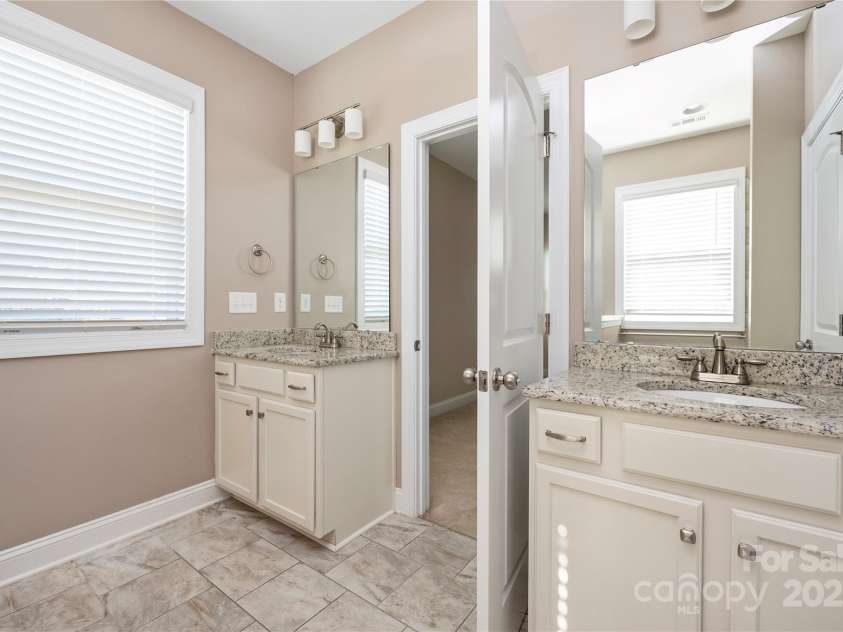 9026 Raven Top Drive, Mint Hill, NC 28227.  MLS# CAR4316455, YatesRealty ID 14246. Primary bath has two vanities.