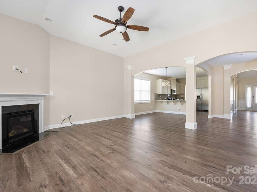 9026 Raven Top Drive, Mint Hill, NC 28227.  MLS# CAR4316455, YatesRealty ID 14246. This angle of the family room shows how it flows nicely from kitchen and eating area.