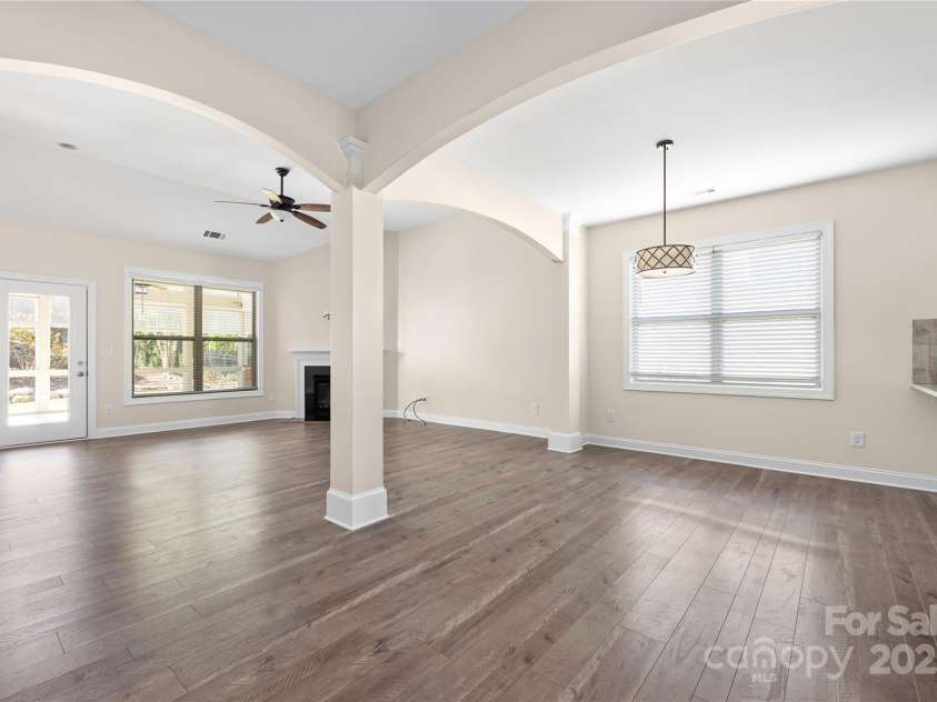 9026 Raven Top Drive, Mint Hill, NC 28227.  MLS# CAR4316455, YatesRealty ID 14246. This view shows large eat in kitchen space and the flow to the family room and on out to the three season room.