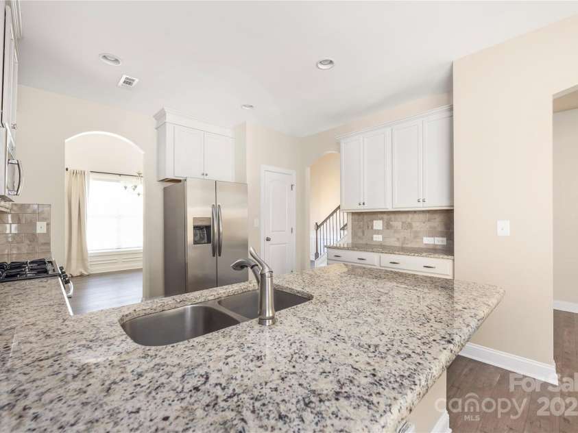 9026 Raven Top Drive, Mint Hill, NC 28227.  MLS# CAR4316455, YatesRealty ID 14246. You will appreciate the arches that transition to each room.