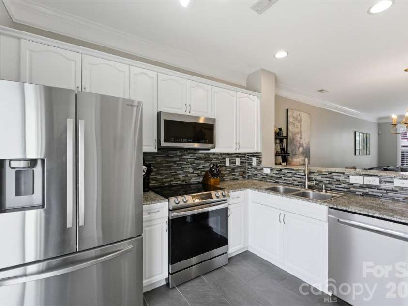 8341 Scotney Bluff Avenue, Charlotte, NC 28273.  MLS# CAR4366829, YatesRealty ID 14247. SS appliances, Painted cabinets, tile Backsplash added