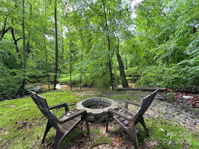 2437 Woodleigh Drive, Gastonia, NC 28056.  MLS# CAR4255182, YatesRealty ID 14250. Fire Pit by Creek