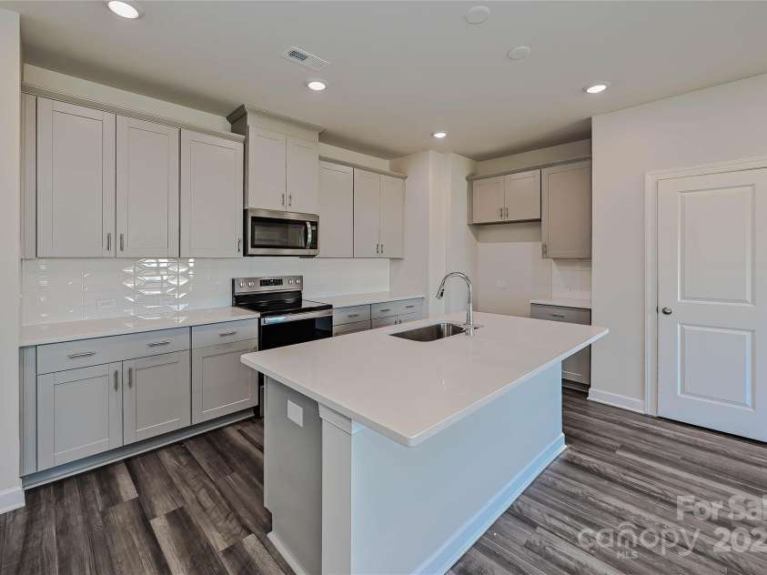 1420 Wildflower Street, Newton, NC 28658.  MLS# CAR4255296, YatesRealty ID 14259. Photo is not of the actual home, but is an inspirational photo of builder’s model home and may depict options, furnishings, and/or decorator features that are not included