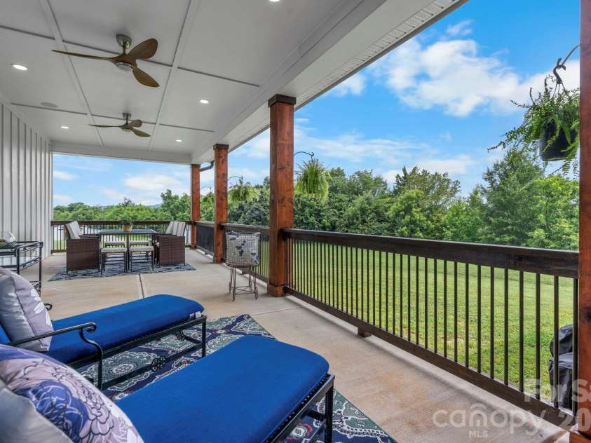 5780 Hwy 10 Highway, Hickory, NC 28602.  MLS# CAR4355019, YatesRealty ID 14260. Back covered porch