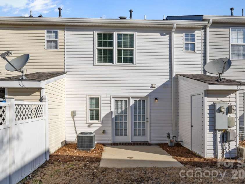 209 Primrose Walk, Fort Mill, SC 29715.  MLS# CAR4346413, YatesRealty ID 14281. Attached exterior storage room provides valuable additional space for bikes, seasonal décor, tools, or items you’d rather not store inside the home.