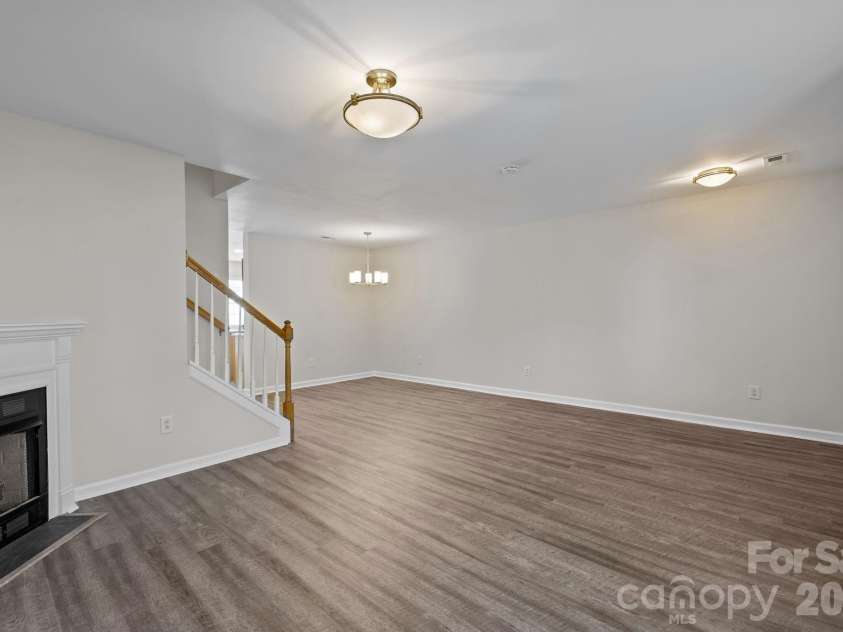 209 Primrose Walk, Fort Mill, SC 29715.  MLS# CAR4346413, YatesRealty ID 14281. Open sight lines between living room and dining area.
