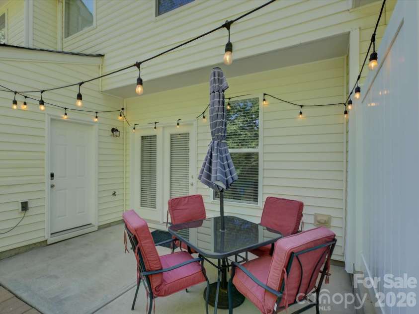 1912 Aston Mill Place, Charlotte, NC 28273.  MLS# CAR4367491, YatesRealty ID 14288. Back Porch with storage unit