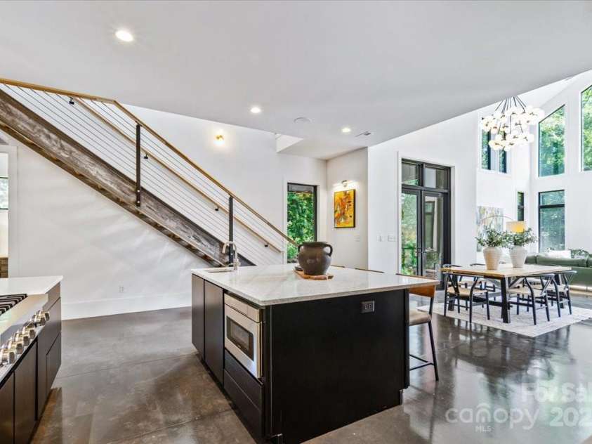 3304 Mar Vista Circle, Charlotte, NC 28209.  MLS# CAR4269142, YatesRealty ID 1429. 6'x5' center island with prep sink, built in microwave, and seating for 3.