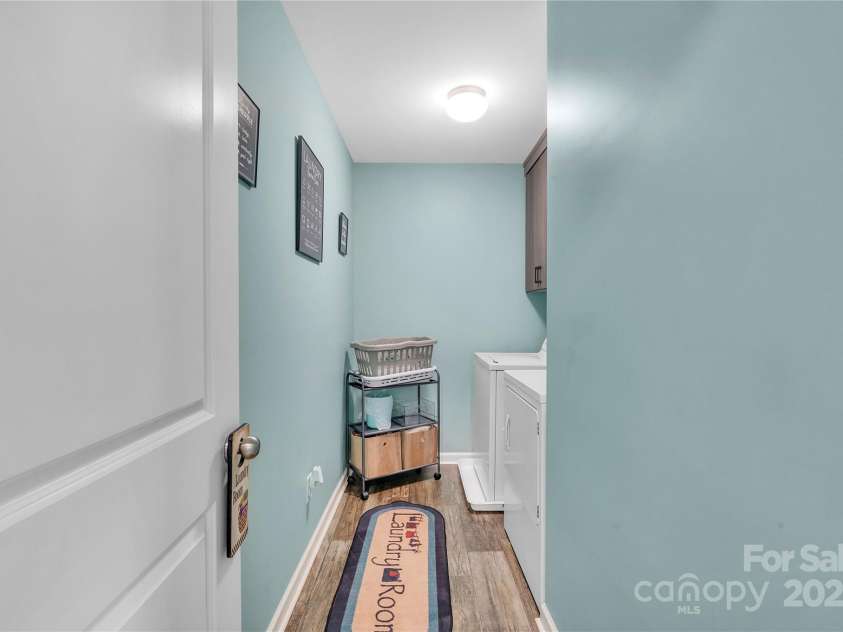 3578 Saddlebrook Drive, Midland, NC 28107.  MLS# CAR4252772, YatesRealty ID 14291. First Floor laundry with cabinets.