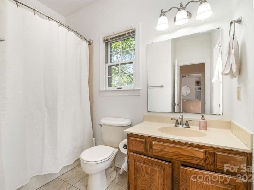 119 Lakenheath Lane, Matthews, NC 28105.  MLS# CAR4241430, YatesRealty ID 14292. Guest bath adjoining 2nd bedroom on main level