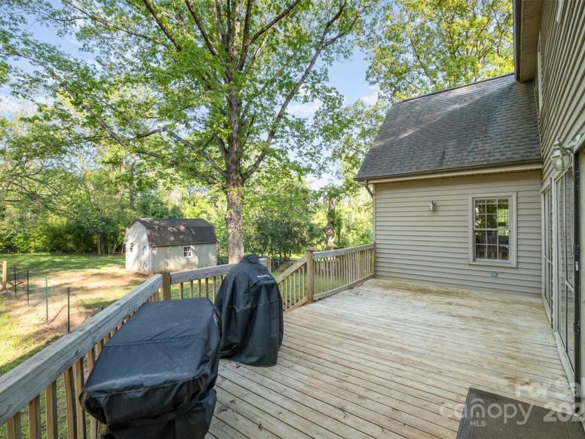119 Lakenheath Lane, Matthews, NC 28105.  MLS# CAR4241430, YatesRealty ID 14292. Large deck