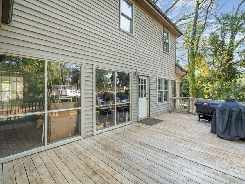 119 Lakenheath Lane, Matthews, NC 28105.  MLS# CAR4241430, YatesRealty ID 14292. Large deck