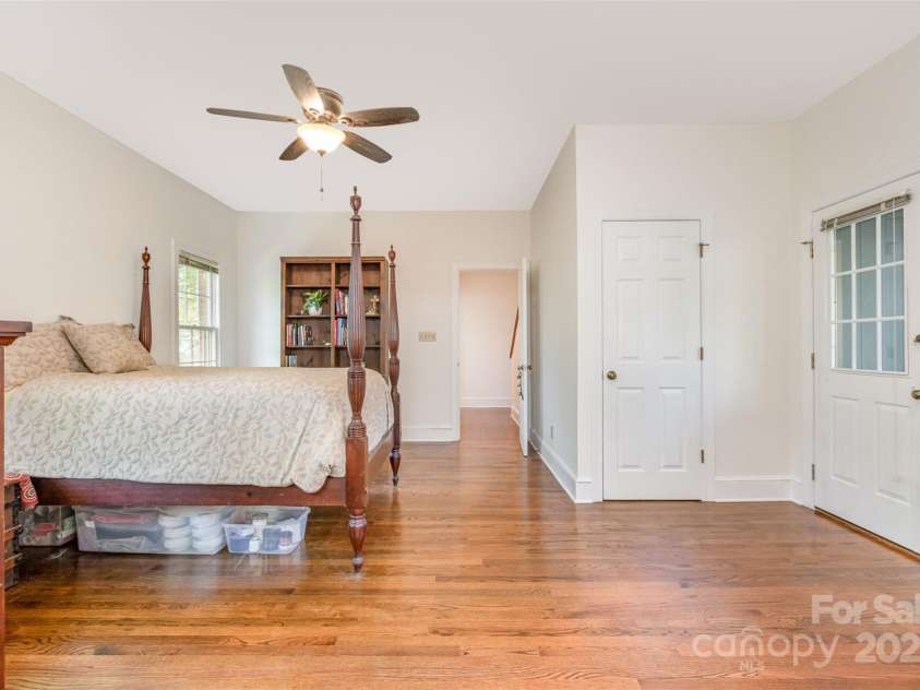 119 Lakenheath Lane, Matthews, NC 28105.  MLS# CAR4241430, YatesRealty ID 14292. Primary with one of two walk-in closets and door to sunroom