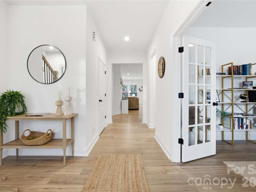 607 Southstone Drive, Matthews, NC 28104.  MLS# CAR4346375, YatesRealty ID 14292. Entry and Library/flex-space