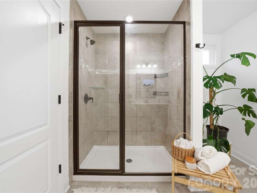 607 Southstone Drive, Matthews, NC 28104.  MLS# CAR4346375, YatesRealty ID 14292. Primary Shower