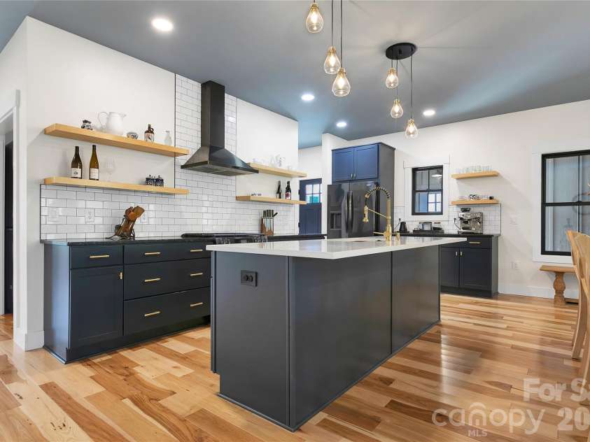 71 Hidden Pond Lane, Brevard, NC 28712.  MLS# CAR4367829, YatesRealty ID 14300. Chef's kitchen with gas range with a dehydrator function