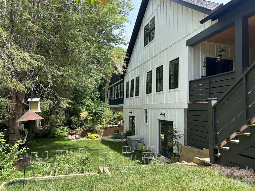 71 Hidden Pond Lane, Brevard, NC 28712.  MLS# CAR4367829, YatesRealty ID 14300. Quiet backyard with vegetable garden