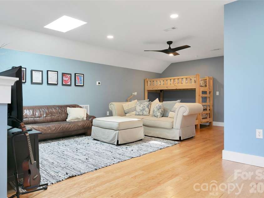 71 Hidden Pond Lane, Brevard, NC 28712.  MLS# CAR4367829, YatesRealty ID 14300. The second level Family Room