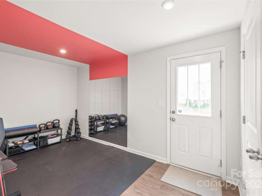 5023 Daybell Street, Charlotte, NC 28214.  MLS# CAR4261011, YatesRealty ID 14305. Downstairs flexspace.