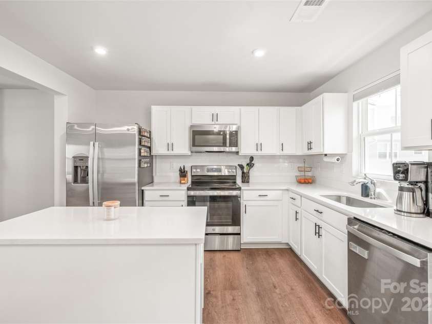5023 Daybell Street, Charlotte, NC 28214.  MLS# CAR4261011, YatesRealty ID 14305. Quartz countertops. Stainless steel appliances. Ample cabinet space.