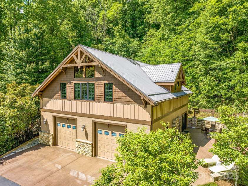 202 Emerald Lane, Maggie Valley, NC 28751.  MLS# CAR4047356, YatesRealty ID 14350. Guest House above a 4+car garage.
