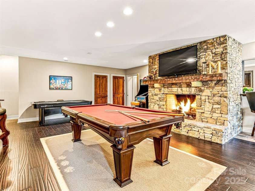 202 Emerald Lane, Maggie Valley, NC 28751.  MLS# CAR4047356, YatesRealty ID 14350. Party room lower level.