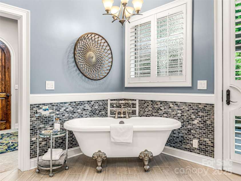 202 Emerald Lane, Maggie Valley, NC 28751.  MLS# CAR4047356, YatesRealty ID 14350. Recently remodeled Primary bath.