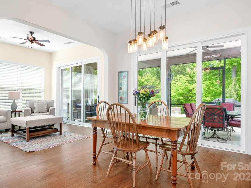 4902 Looking Glass Trail, Denver, NC 28037.  MLS# CAR4250662, YatesRealty ID 14354. Large Dining Area With Rolling Doors To Your Screened Porch