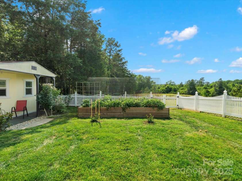 2521 Neely Store Road, Rock Hill, SC 29730.  MLS# CAR4258625, YatesRealty ID 14356. Side Yard and Garden