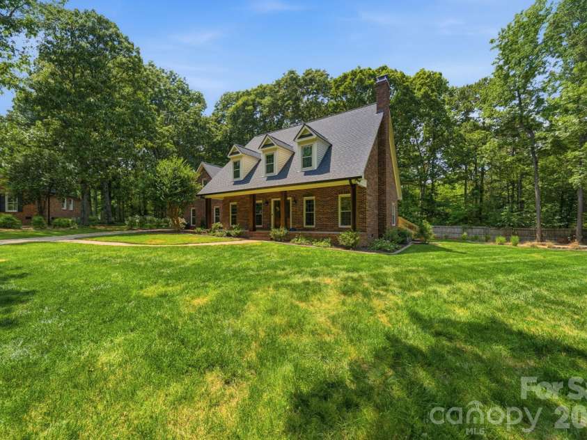 5243 Mintridge Road, Mint Hill, NC 28227.  MLS# CAR4358106, YatesRealty ID 14357. Approximately half an acre of full irrigation to keep the lawn healthy and beautiful