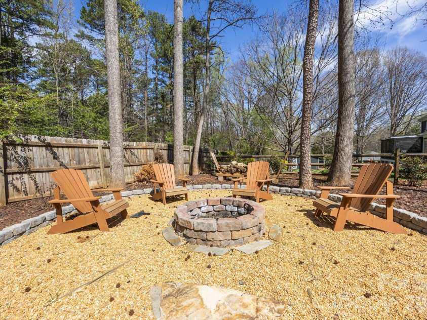 5243 Mintridge Road, Mint Hill, NC 28227.  MLS# CAR4358106, YatesRealty ID 14357. Ready for an evening around a warm fire!  (Adirondack chairs do not convey)