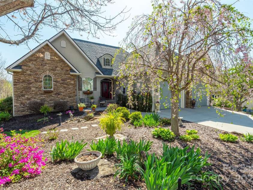 59 Carriage Highlands Court, Hendersonville, NC 28791.  MLS# CAR4243182, YatesRealty ID 14360. Beautifully landscaped yard with in ground irrigation system