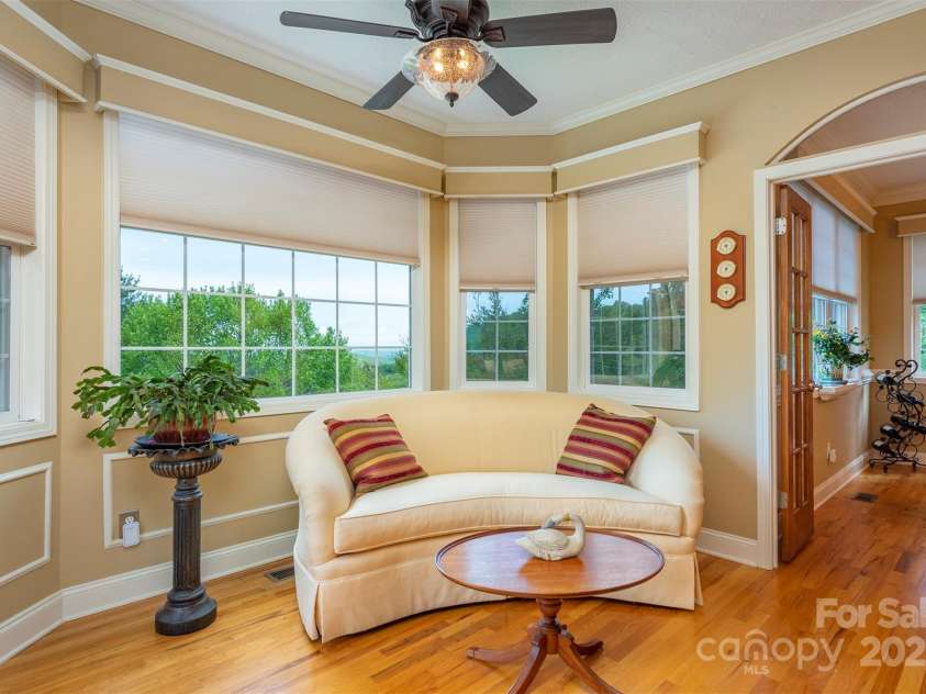 59 Carriage Highlands Court, Hendersonville, NC 28791.  MLS# CAR4243182, YatesRealty ID 14360. Cozy sitting area with a view-could easily become your new favorite breakfast nook!
