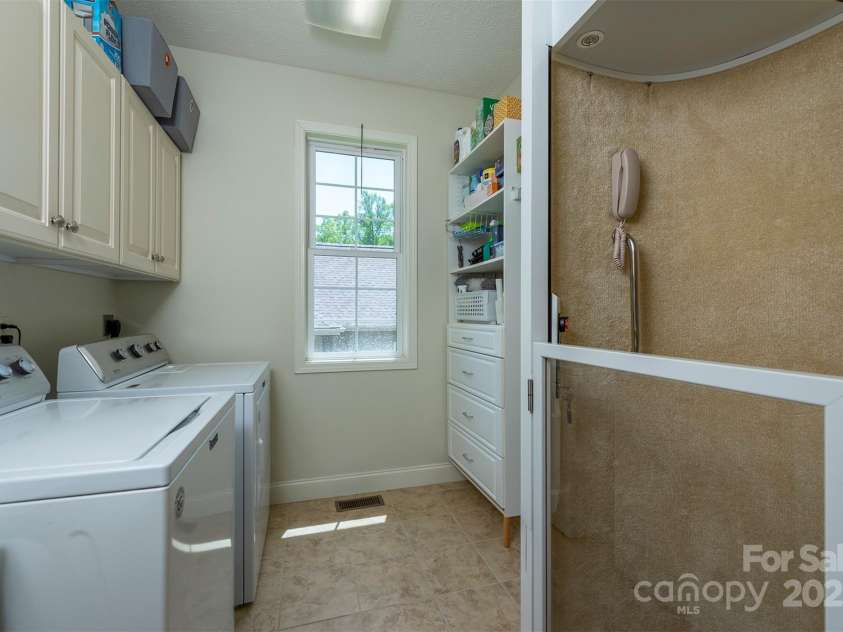 59 Carriage Highlands Court, Hendersonville, NC 28791.  MLS# CAR4243182, YatesRealty ID 14360. Elevator Access to downstairs.