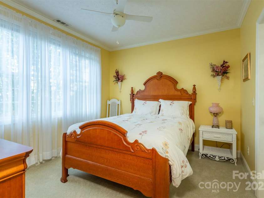 59 Carriage Highlands Court, Hendersonville, NC 28791.  MLS# CAR4243182, YatesRealty ID 14360. Guest bedroom - *approximately 120 sq ft that was not permitted when wall was added*