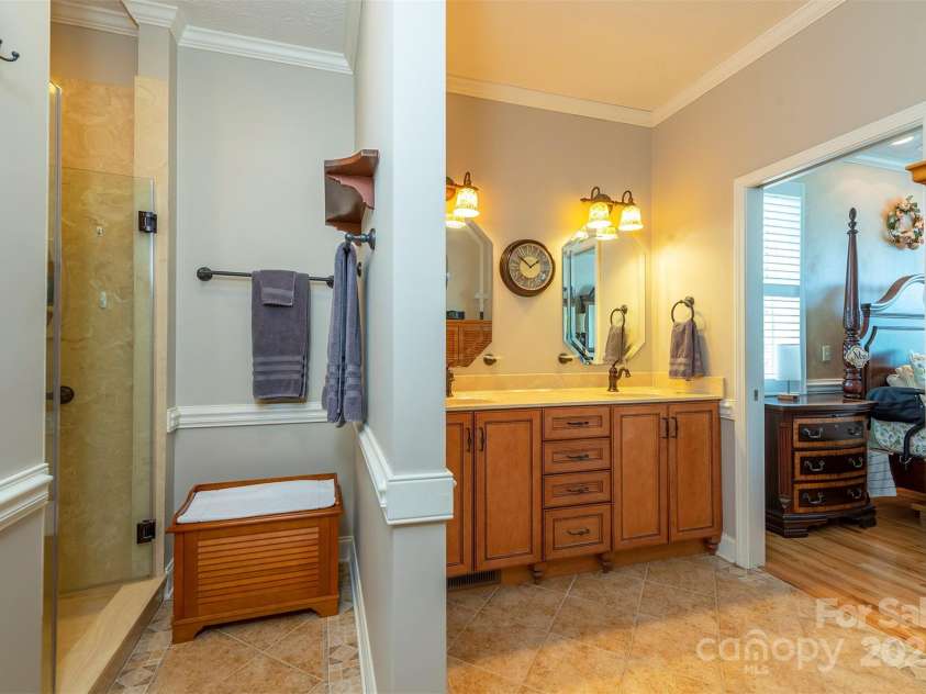 59 Carriage Highlands Court, Hendersonville, NC 28791.  MLS# CAR4243182, YatesRealty ID 14360. Primary Bathroom with walk in shower and walk in closet