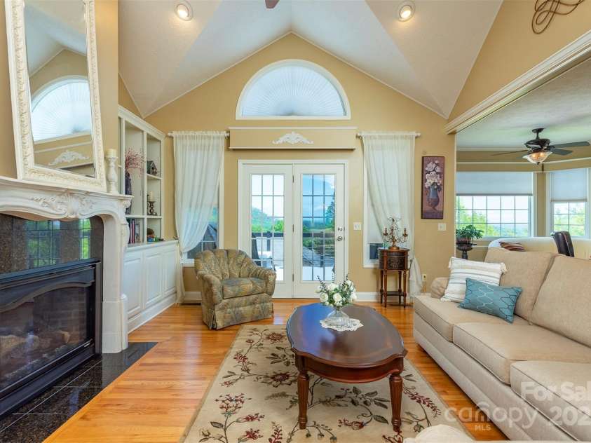 59 Carriage Highlands Court, Hendersonville, NC 28791.  MLS# CAR4243182, YatesRealty ID 14360. Soaked in natural light create a warm, welcoming space on the main level.