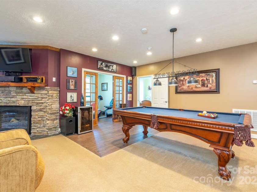 59 Carriage Highlands Court, Hendersonville, NC 28791.  MLS# CAR4243182, YatesRealty ID 14360. Some furniture may convey with reasonable offer.