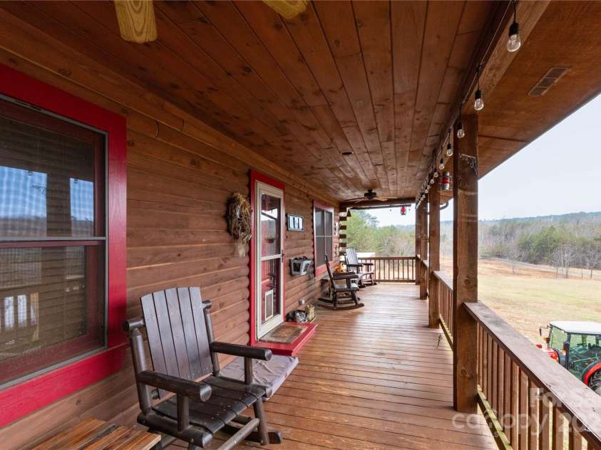 556 Emerald Parkway, Rutherfordton, NC 28139.  MLS# CAR4225778, YatesRealty ID 14366. Side of home with shed