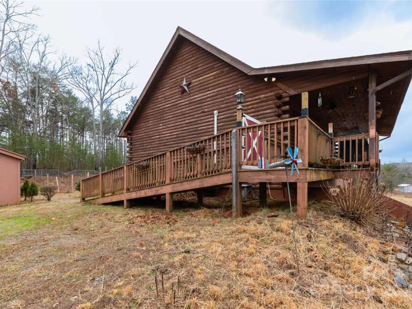 556 Emerald Parkway, Rutherfordton, NC 28139.  MLS# CAR4225778, YatesRealty ID 14366. Side of home with shed