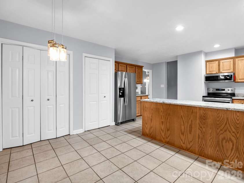 10 Chestnut Ridge Road, Mills River, NC 28759.  MLS# CAR4412466, YatesRealty ID 14367. Breakfast, view toward Kitchen & Double Pantry