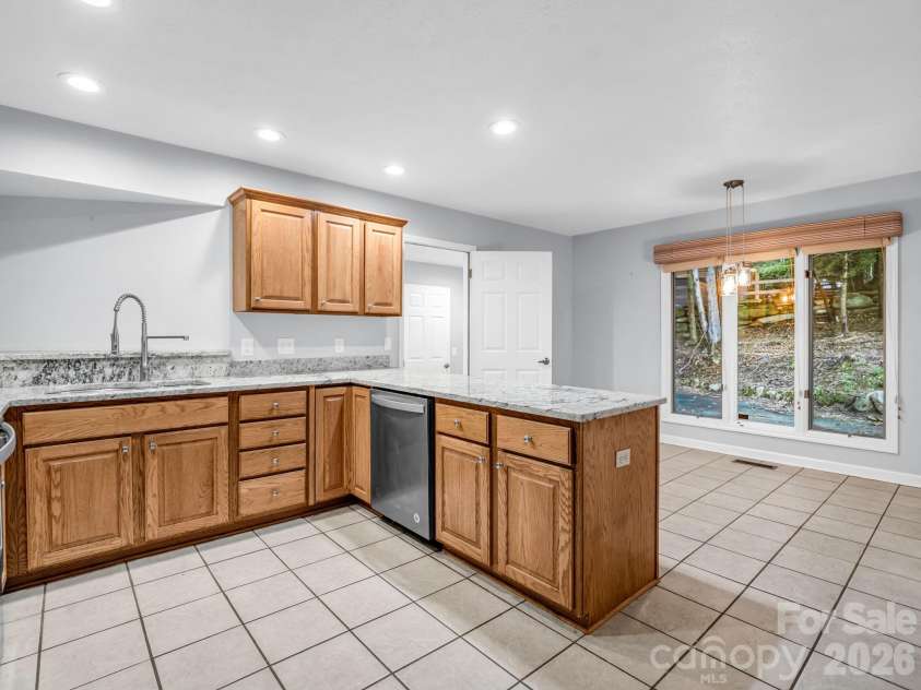10 Chestnut Ridge Road, Mills River, NC 28759.  MLS# CAR4412466, YatesRealty ID 14367. Enter Kitchen from Dining Room, view towards Breakfast & door to Laundry