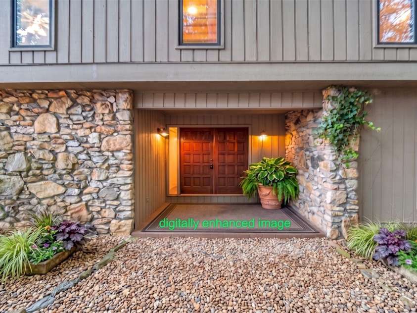 10 Chestnut Ridge Road, Mills River, NC 28759.  MLS# CAR4412466, YatesRealty ID 14367. Front Entrance - planters, rug & river stone walkway are digitally enhanced