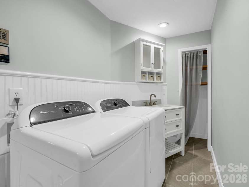 10 Chestnut Ridge Road, Mills River, NC 28759.  MLS# CAR4412466, YatesRealty ID 14367. Laundry/Mudroom, situated between Garage & Kitchen