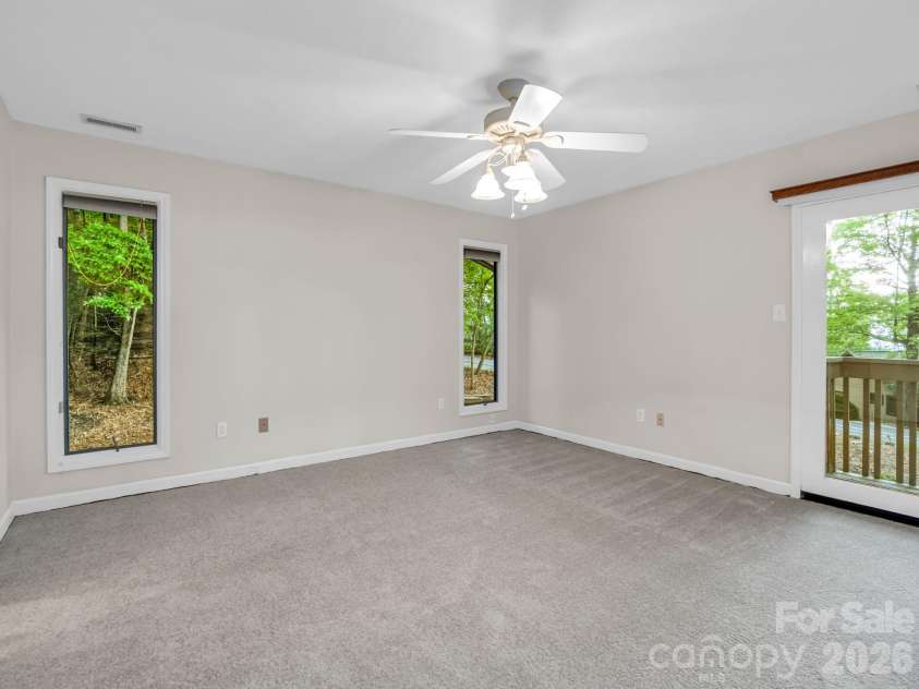 10 Chestnut Ridge Road, Mills River, NC 28759.  MLS# CAR4412466, YatesRealty ID 14367. Primary Bedroom with private balcony deck