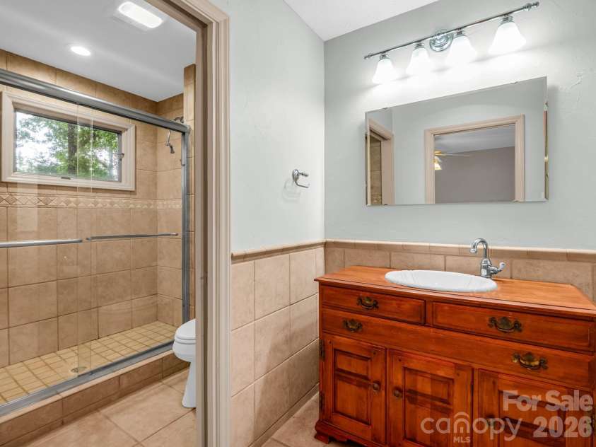 10 Chestnut Ridge Road, Mills River, NC 28759.  MLS# CAR4412466, YatesRealty ID 14367. Primary en suite bath; large walk-in tile shower