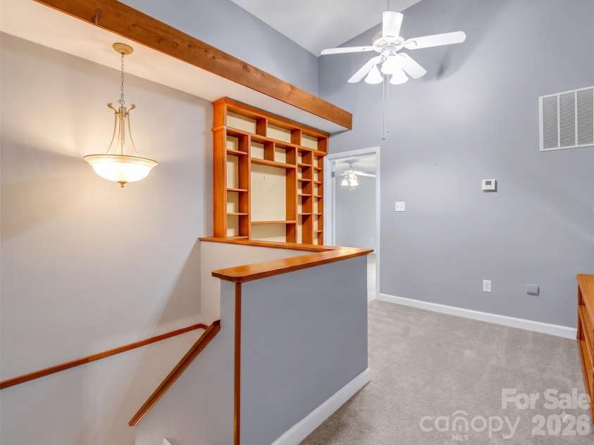 10 Chestnut Ridge Road, Mills River, NC 28759.  MLS# CAR4412466, YatesRealty ID 14367. View from Loft toward Primary Bedroom Suite