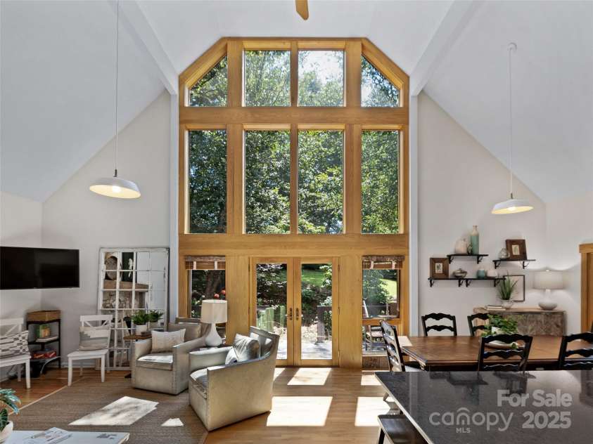 34 Ivy Lane, Fletcher, NC 28732.  MLS# CAR4242162, YatesRealty ID 14376. Light filled rooms, windows abound bringing with beautiful water, pasture & Mounain views