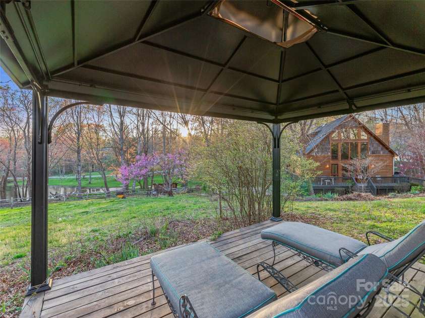 34 Ivy Lane, Fletcher, NC 28732.  MLS# CAR4242162, YatesRealty ID 14376. Relax in the gazebo with a glass of wine or morning coffee