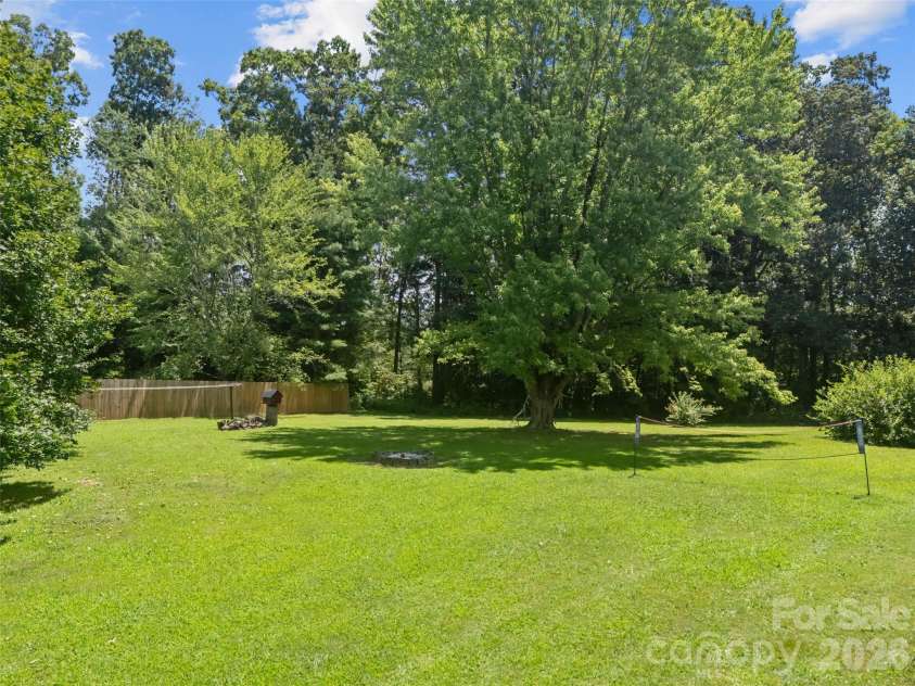 50 Baldwin Road, Arden, NC 28704.  MLS# CAR4402353, YatesRealty ID 14376. Tree-lined Backyard